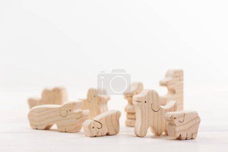 Photo for Wooden toy animals on light background - Royalty Free Image