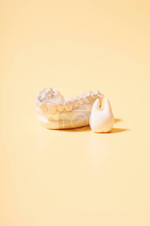 Photo for Orthodontic dental theme on yellow background. - Royalty Free Image