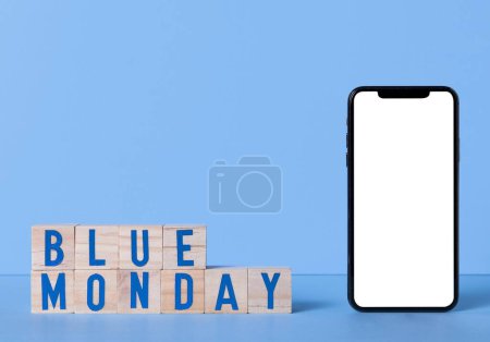 Photo for "blue monday with smartphone and wooden cubes" - Royalty Free Image