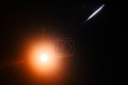 Photo for Abstract Natural Sun flare or Far star on the black background - Royalty Free Image