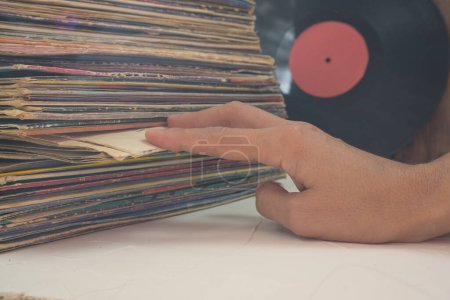 Photo for Browsing through vinyl records collection. Music background - Royalty Free Image