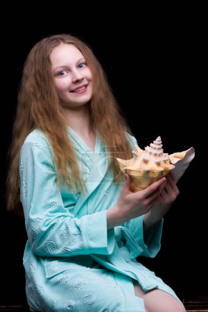 Photo for Little girl with seashell on black background - Royalty Free Image