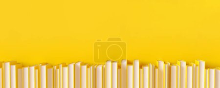 Téléchargez les photos : Une rangée de livres jaunes sur fond jaune - en image libre de droit