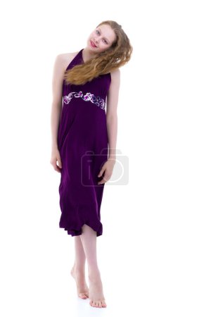Photo for Little girl in a dress developing in the wind. - Royalty Free Image