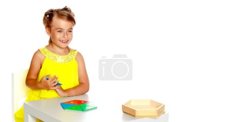 Photo for A little girl is studying Montessori stuff. - Royalty Free Image