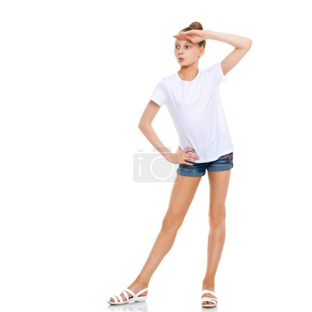 Photo for "Emotional little girl in a clean white T-shirt." - Royalty Free Image