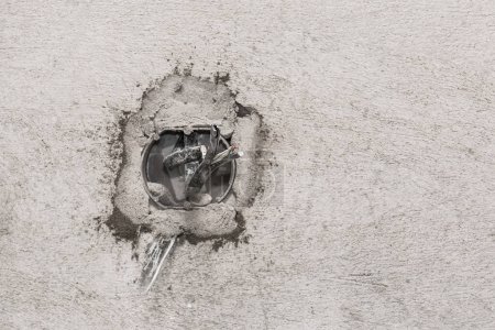 Photo for Niche for installing several electrical outlets on a gray concrete wall, home repair - Royalty Free Image