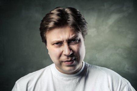Photo for Emotional angry middle aged man over gray - Royalty Free Image