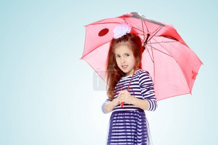 Photo for Little girl hiding under an umbrella. - Royalty Free Image