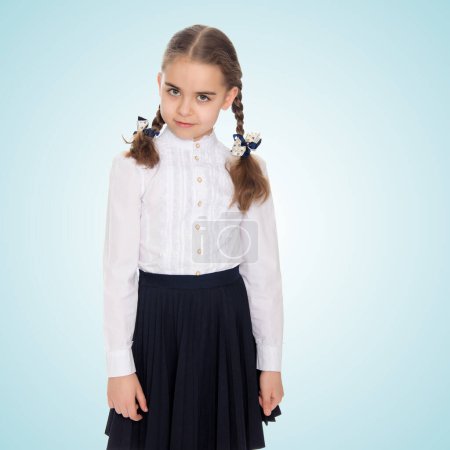 Photo for A little girl in a white dress and a dark skirt. - Royalty Free Image