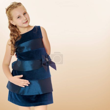 Photo for Beautiful little girl dressed in a blue dress. - Royalty Free Image