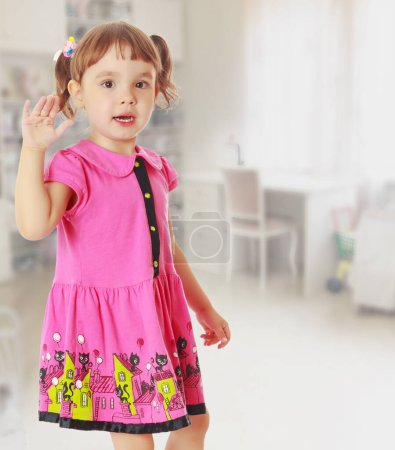 Photo for Portrait of cute little girl waving - Royalty Free Image