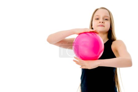 Photo for Little girl is engaged in fitness with a ball. - Royalty Free Image