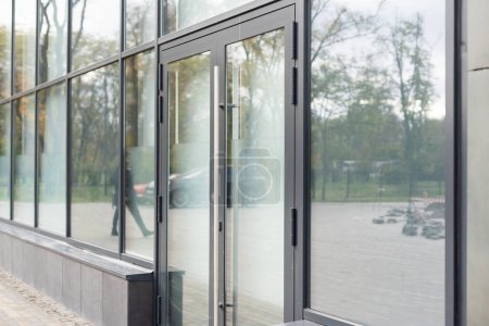 Photo for Outside solid glass door with building exterior - Royalty Free Image