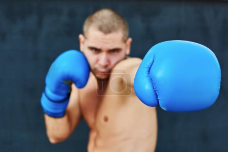 Photo for Boxer in blue gloves - Royalty Free Image