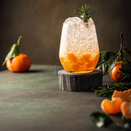 Photo for Fresh cocktail with crushed ice, rosemary and tangerines - Royalty Free Image