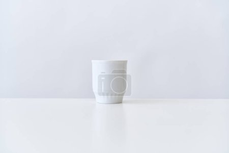 Photo for "wireless keyboard on desktop cup documents office" - Royalty Free Image