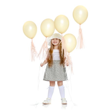 Photo for Little girl is playing with a balloon - Royalty Free Image