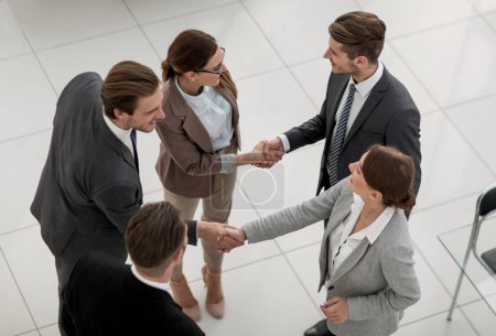 Photo for "top view.business team talking standing in the office" - Royalty Free Image