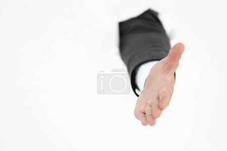 Photo for Businessman holding out his hand for a handshake . - Royalty Free Image