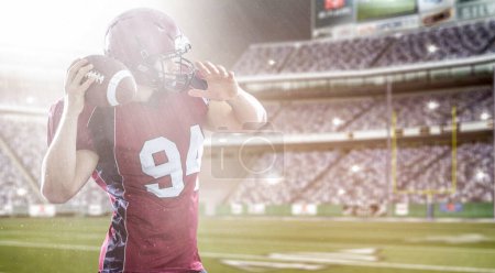 Téléchargez les photos : Joueur de football américain lancer ballon - en image libre de droit