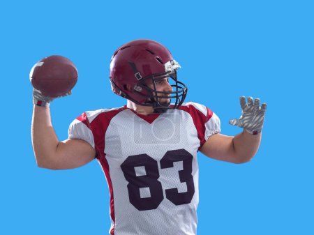 Téléchargez les photos : Joueur de football américain lancer ballon - en image libre de droit