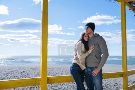 Photo for Couple chating and having fun at beach - Royalty Free Image