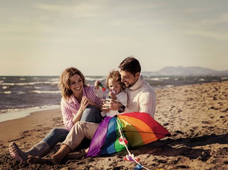 Photo for Young family enjoying vacation during autumn day - Royalty Free Image