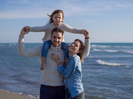 Photo for Young family enjoying vacation during autumn day - Royalty Free Image