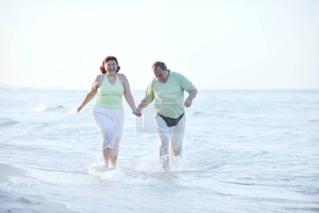 Photo for Happy seniors couple on beach - Royalty Free Image