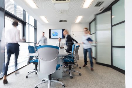 Photo for Business people group entering meeting room, motion blur - Royalty Free Image