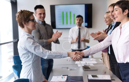 Photo for Business women handshake in office - Royalty Free Image