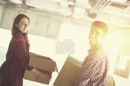 Photo for Business team carrying cardboard boxes - Royalty Free Image