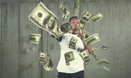 Photo for "black businessman making the rain of money" - Royalty Free Image