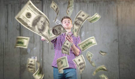 Photo for "businessman making the rain of money" - Royalty Free Image