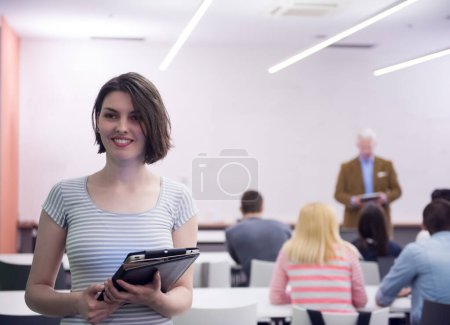 Photo for Portrait of happy female student in classroom - Royalty Free Image