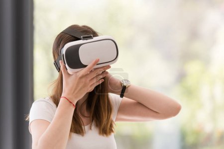 Photo for Woman using VR-headset glasses of virtual reality - Royalty Free Image