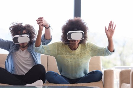 Photo for Multiethnic Couple using virtual reality headset - Royalty Free Image