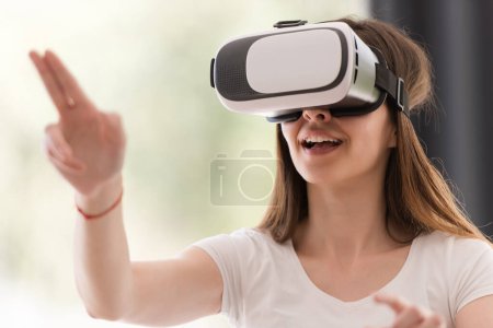 Photo for Woman using VR-headset glasses of virtual reality - Royalty Free Image