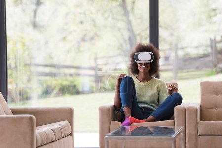 Photo for "black woman using VR headset glasses of virtual reality" - Royalty Free Image