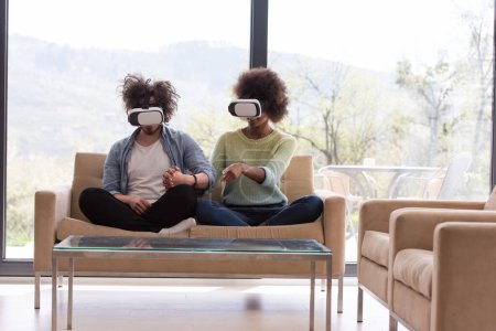 Photo for "Multiethnic Couple using virtual reality headset" - Royalty Free Image