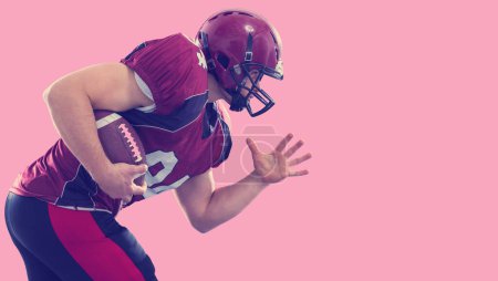 Photo for "American football Player running with the ball" - Royalty Free Image