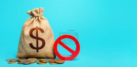 Photo for Dollars money bag and red prohibition sign NO. Prohibition on the possession of American currency. Monetary restrictions, freezing and seizure of bank accounts. Forced withdrawal of deposits. - Royalty Free Image