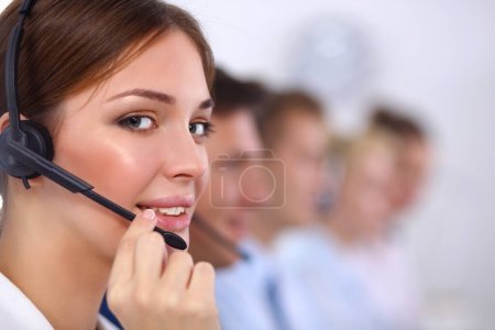 Photo for Smiling positive young businesspeople and colleagues in a call center office - Royalty Free Image