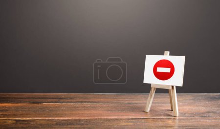 Photo for Easel with no entry symbol. Prohibition of actions and operations, restricted area. Ban and sanctions. Isolation zone and quarantine. Wrong direction. Failed strategy. Inaccessibility, taboo. - Royalty Free Image