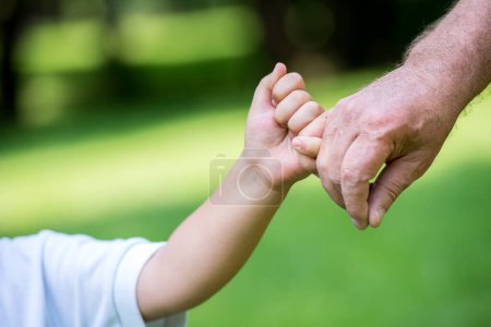 Photo for Grandfather and child have fun  in park - Royalty Free Image