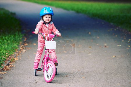 Little girl with bicycle
