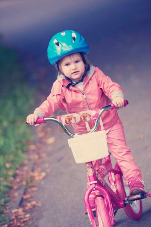Photo for Little girl with bicycle - Royalty Free Image