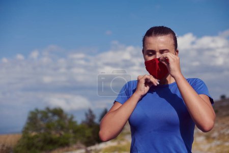 Photo for Woman with protective mask  relaxing after running - Royalty Free Image