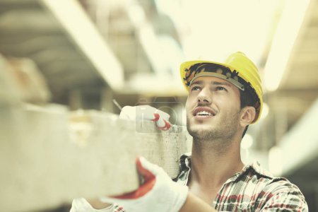 Photo for Hard worker on construction site" - Royalty Free Image